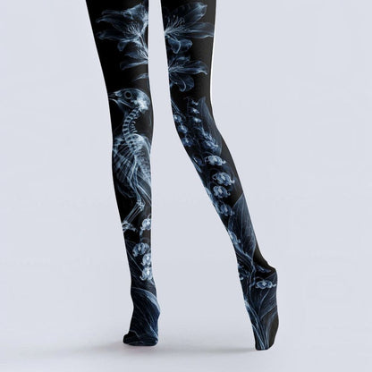 Avaeri black tights featuring see-through X-ray style prints of flowers and bird skeletons, crafted from comfortable stretch fabric, are ideal for dark romantic style outfits.